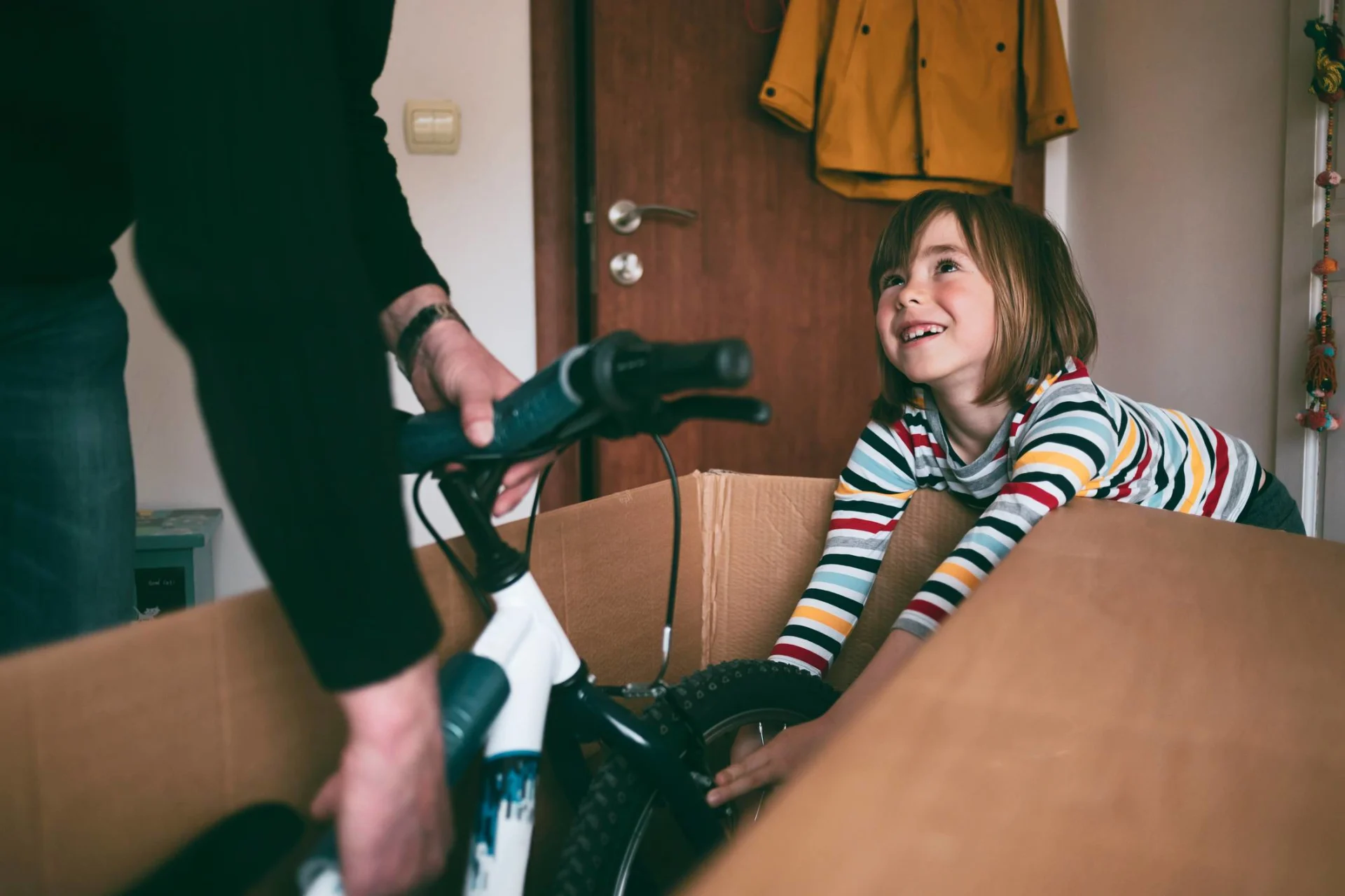 Girl unpacking new bicycle